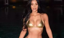 Kim Kardashian altın rengi bikinisiyle çarpıcı pozlar verdi